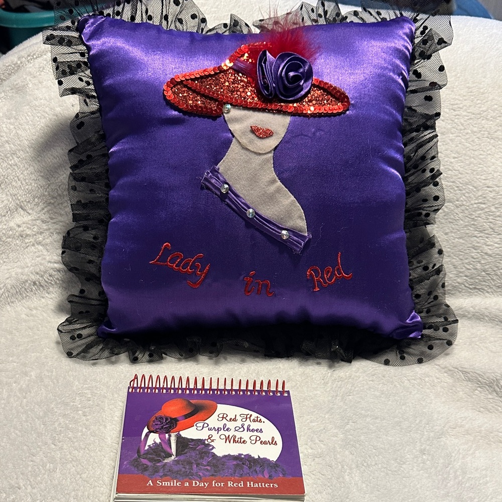 Purple Decorative Pillow with Red Hat Design